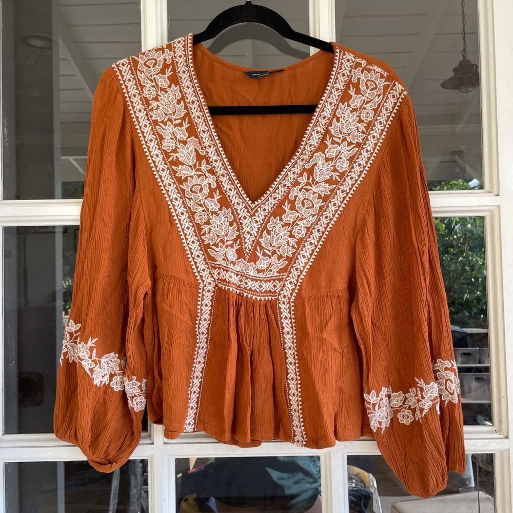 Burnt orange top with white detailing